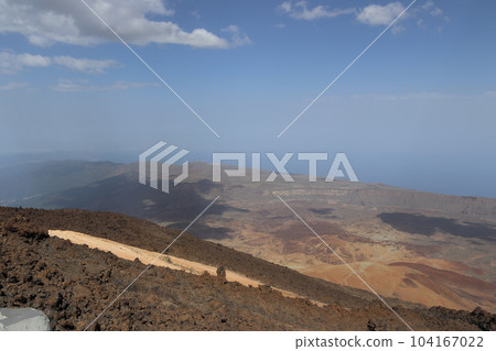 Panoramic view of volcanic lanscape in front of the ocean from the peak of mountain Teide, Tenerife Panoramic view of volcanic lanscape in front of the ocean from the peak of mountain Teide, Tenerife 104167022
