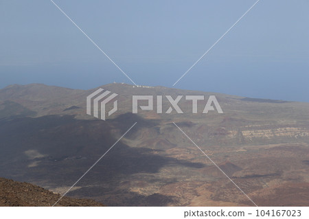 Panoramic view of volcanic lanscape in front of the ocean from the peak of mountain Teide, Tenerife Panoramic view of volcanic lanscape in front of the ocean from the peak of mountain Teide, Tenerife 104167023