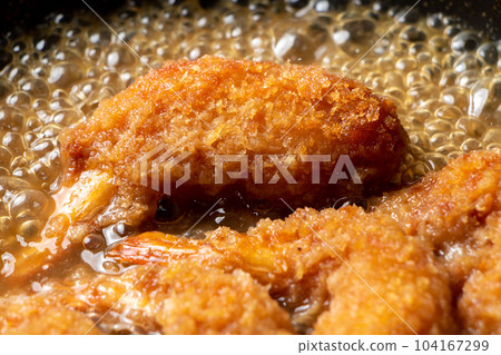 Leftover fried food (fried shrimp) remake cooking scene. Boil in a frying pan with dashi stock to bind the egg. Leftover fried food (fried shrimp) remake cooking scene. Boil in a frying pan with dashi stock to bind the egg. 104167299