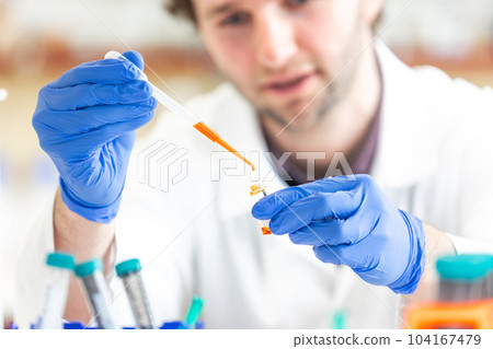 Young man researcher carrying out scientific research in a laboratory science center, concept of develop new pharmacy 104167479