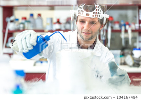 Young man researcher carrying out scientific research in a laboratory science center, concept of develop new pharmacy 104167484