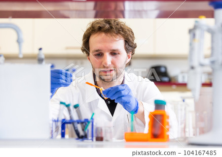 Young man researcher carrying out scientific research in a laboratory science center, concept of develop new pharmacy 104167485