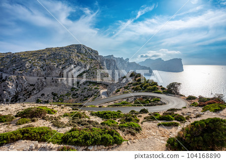 Winding narrow road to lighthouse at Cape Formentor in the Coast of North Mallorca, Spain 104168890