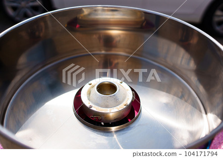 bowl of Cotton candy machine. A portable device designed to create candy 104171794