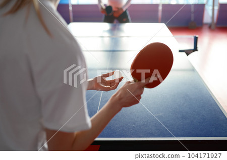 Cropped view of woman playing table tennis Cropped view of woman playing table tennis 104171927