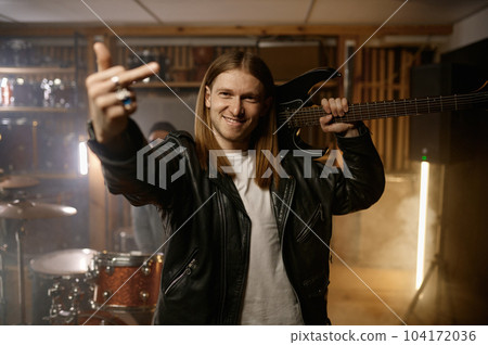 Rock musician gesturing fuck off middle finger gesture to camera 104172036