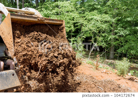 In preparation for construction improvement work site is planned territory of using tractor 104172674