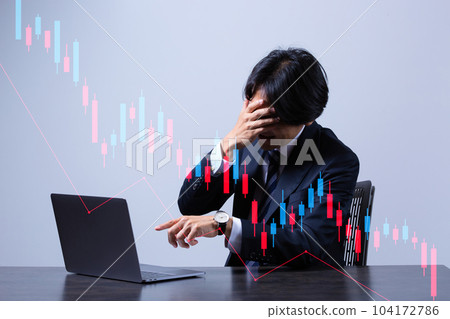 Businessman trading stocks on laptop Businessman trading stocks on laptop 104172786