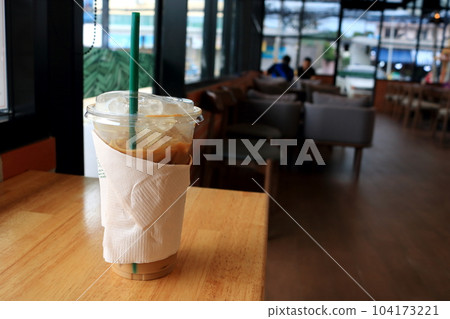 Ice coffee on wood table in shop. 104173221