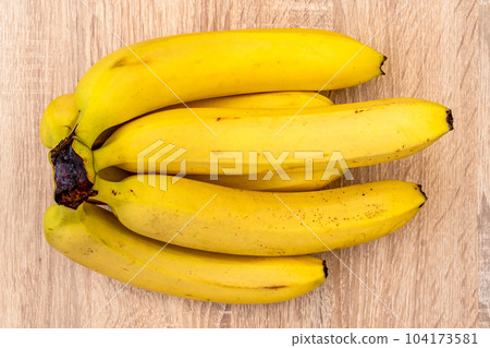 Ripe organic bananas, top view Ripe organic bananas, top view 104173581