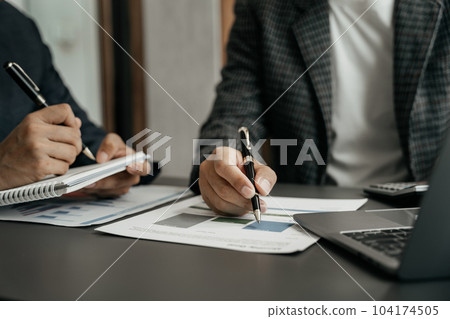 Business team working and studying together with tablet document graph paper in office, discuss finance and marketing solution reporting file in working place. 104174505