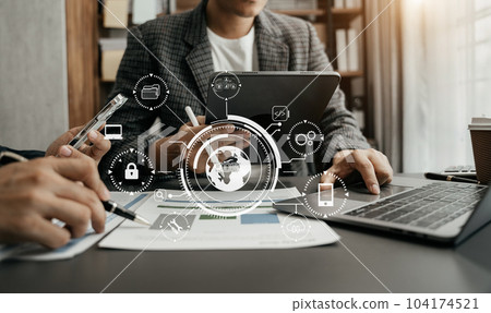 Person typing laptop computer and tablet with SDK icon on virtual screen. SDK Software development kit programming language technology concept in office. 104174521