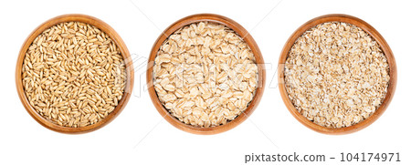 Oat grains, rolled oats and oatmeal, in wooden bowls. Husked common oat, Avena sativa, a cereal grain. Dehusked steamed oat groats, rolled into flat flakes, toasted, used whole or as steel-cut flakes. Oat grains, rolled oats and oatmeal, in wooden bowls. Husked common oat, Avena sativa, a cereal grain. Dehusked steamed oat groats, rolled into flat flakes, toasted, used whole or as steel-cut flakes. 104174971