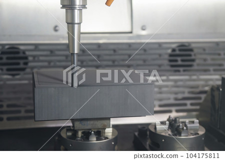 The CNC milling machine rough cutting the graphite electrode parts with solid flat end mill. The CNC milling machine rough cutting the graphite electrode parts with solid flat end mill. 104175811