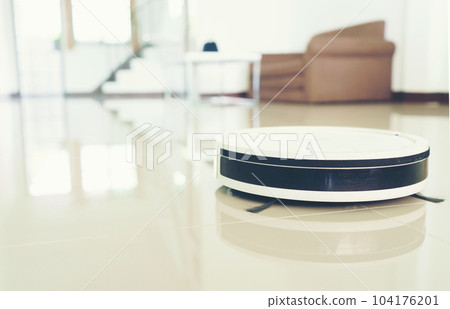 vacuum cleaning robot cleaning the room. vacuum cleaning robot cleaning the room. 104176201