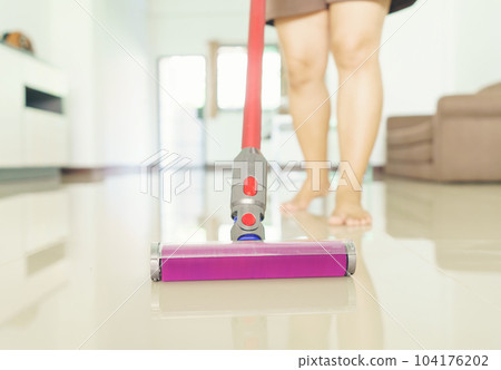 clean floor with a vacuum cleaner at home clean floor with a vacuum cleaner at home 104176202