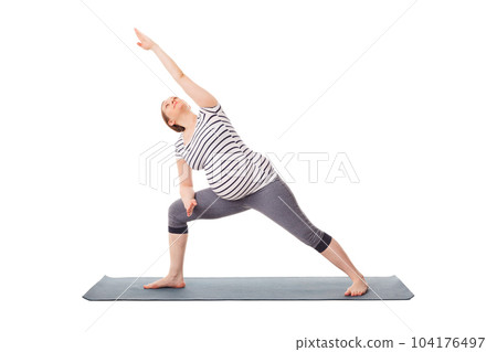 Pregnancy yoga exercise - pregnant woman doing asana Utthita Parsvakonasana - Extended Side Angle Pose isolated on white background 104176497