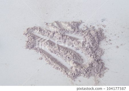 Glittering pink and silvery stroke eye shadow scattered over white background Glittering pink and silvery stroke eye shadow scattered over white background 104177387