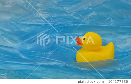 Pollution Plastic In Sea with Yellow Rubber Duck Toy Pollution Plastic In Sea with Yellow Rubber Duck Toy 104177586