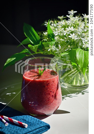 Fresh Berry Smoothie, Paper Straws and Star of Bethlehem Flowers in vase Fresh Berry Smoothie, Paper Straws and Star of Bethlehem Flowers in vase 104177590