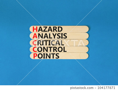 HACCP symbol. Concept words HACCP hazard analysis critical control point on wooden stick. Beautiful blue background. Business HACCP hazard analysis critical control point concept. Copy space. HACCP symbol. Concept words HACCP hazard analysis critical control point on wooden stick. Beautiful blue background. Business HACCP hazard analysis critical control point concept. Copy space. 104177871
