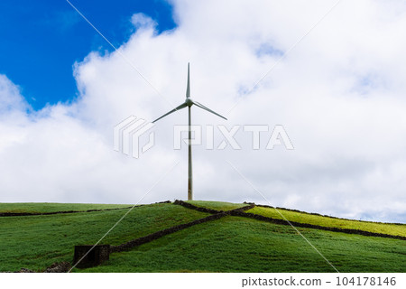 Panoramic view of wind farm or wind park, with high wind turbines for generation electricity with copy space. Panoramic view of wind farm or wind park, with high wind turbines for generation electricity with copy space. 104178146