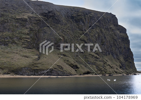Cliffs of the Atlantic ocean, Reynisfjara beach, Vik, Iceland 104178969