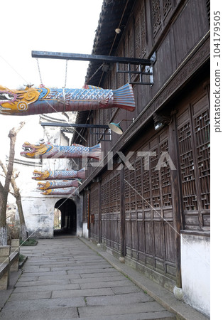 Traditional houses along the Grand Canal, ancient town of Yuehe in Jiaxing, Zhejiang Province, China 104179505