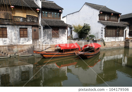 Traditional houses along the Grand Canal, ancient town of Yuehe in Jiaxing, Zhejiang Province, China 104179506