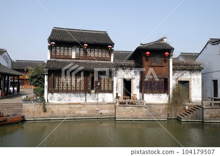 Traditional houses along the Grand Canal, ancient town of Yuehe in Jiaxing, Zhejiang Province, China Traditional houses along the Grand Canal, ancient town of Yuehe in Jiaxing, Zhejiang Province, China 104179507