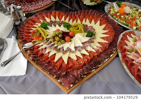 Classic Croatian starter plate with Fine Croatian prosciutto, sliced salami and cheese 104179529