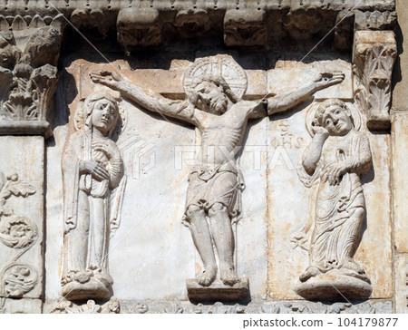 Crucifixion, medieval relief on the facade of Basilica of San Zeno in Verona, Italy Crucifixion, medieval relief on the facade of Basilica of San Zeno in Verona, Italy 104179877