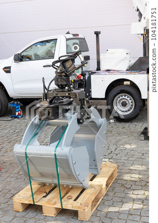 Replaceable bucket for excavator tied to a wooden board Replaceable bucket for excavator tied to a wooden board 104181751