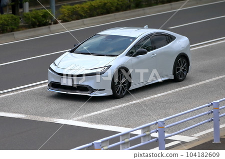 White domestic hybrid car image White domestic hybrid car image 104182609