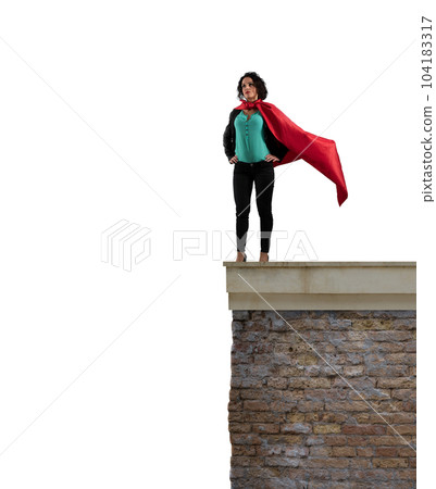 Super businesswoman over a wall ready to fly 104183317