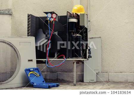 Broken external air conditioner unit with protection cover removed in need of repair, with damaged electric internal components and wiring. Outdoor HVAC system not working anymore, ready to be fixed Broken external air conditioner unit with protection cover removed in need of repair, with damaged electric internal components and wiring. Outdoor HVAC system not working anymore, ready to be fixed 104183634