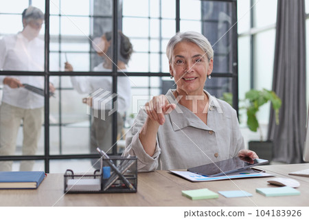 woman writes notes. working at the office at the computer 104183926