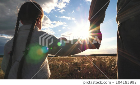 child mother father hand sunset sky, hand mom dad kid girl, happy family childhood dream, child having fun summer park nature, happy childhood, happy family lifestyle, cute kid having fun, mother 104183992