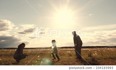 mother child father hug sunset, family happiness run, dream child girl running, mom dad hug sun, dream becoming pilot plane, road along wheat field sunset, hugging child, children parents playing 104183993