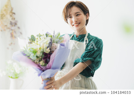 A bouquet of flowers, an apron woman 104184033