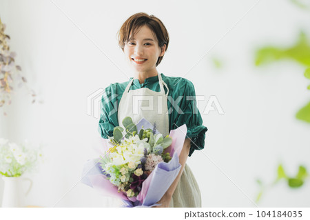 A bouquet of flowers, an apron woman 104184035