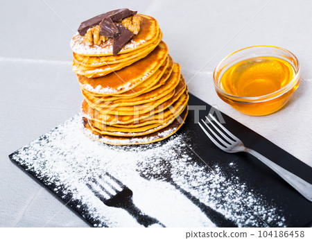 Pancakes with honey and chocolate Pancakes with honey and chocolate 104186458