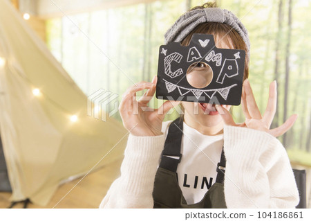 A young woman showing the letters CANP House camp Home camp Camp image 104186861