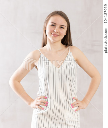 Whole-length, full-length portrait of young woman in tank top dress, close-up. 104187039