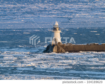 White lighthouse and drift ice seascape / Nemuro, Japan White lighthouse and drift ice seascape / Nemuro, Japan 104189620