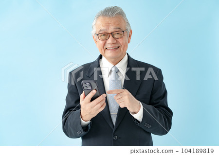Man operating a smartphone business 104189819