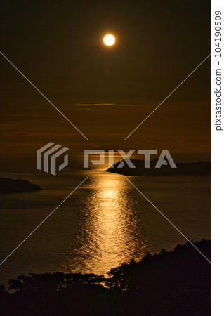 The sun setting over Ikeshima, Nagasaki Prefecture, which used to be a coal mining town. 104190509