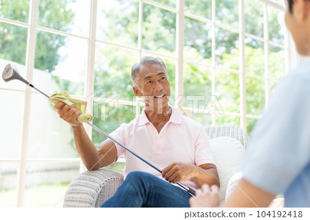 Senior man relaxing in the living room 104192418