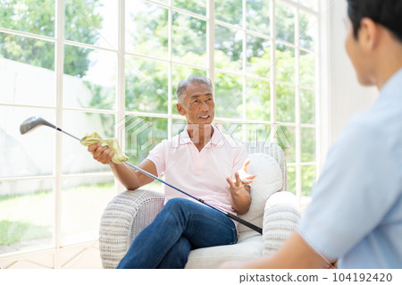 Senior man relaxing in the living room 104192420