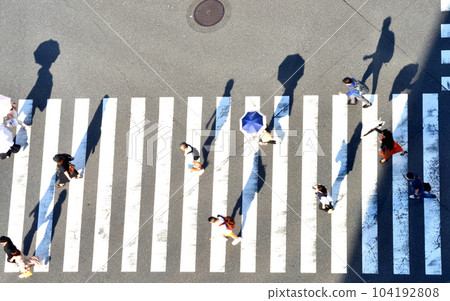 Pedestrian silhouette at Sukiyabashi Scramble Crossing Pedestrian silhouette at Sukiyabashi Scramble Crossing 104192808